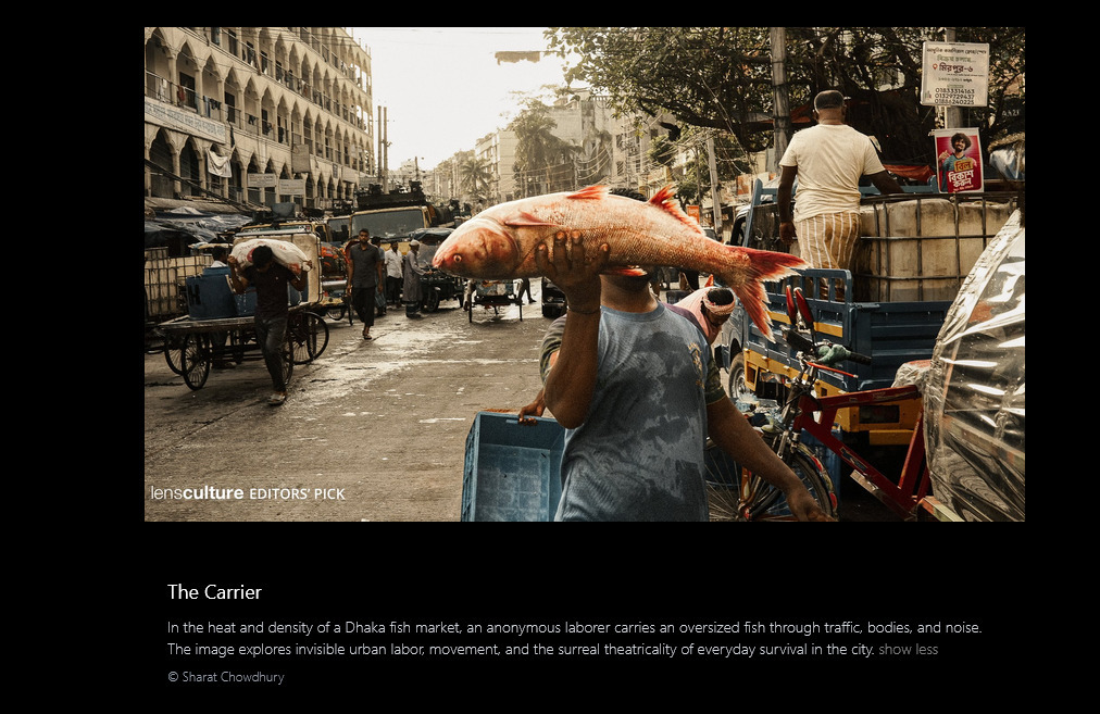 The Carrier – a laborer carrying a large fish through a busy market street in Dhaka, selected as LensCulture Editors’ Pick in the Street Photography Awards 2026.